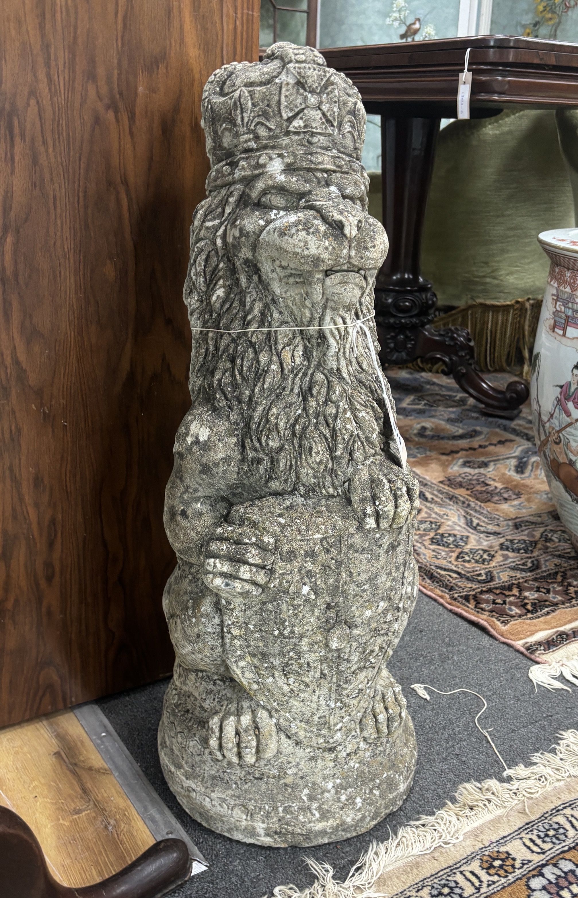 A reconstituted stone lion, 69cm high